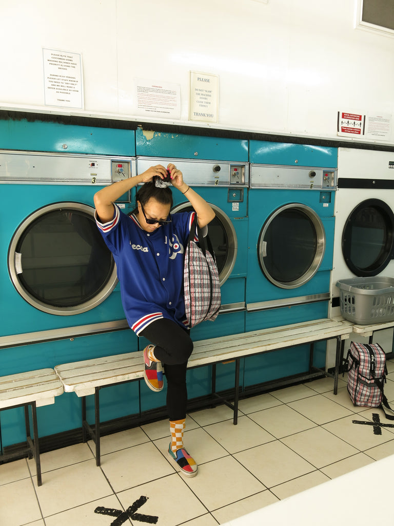 Goodordering laundrette photo shoot with tartan bag range