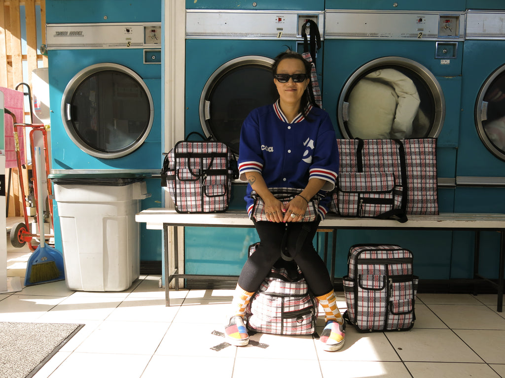 Goodordering laundrette photo shoot with tartan bag range