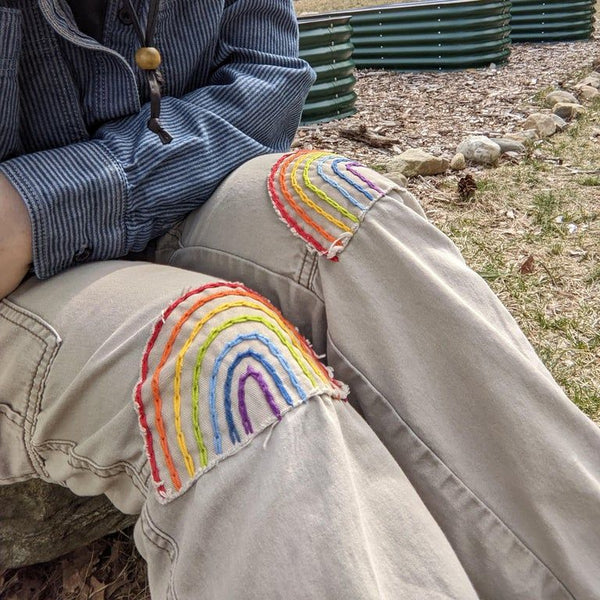 Jeans with rainbow knee patches