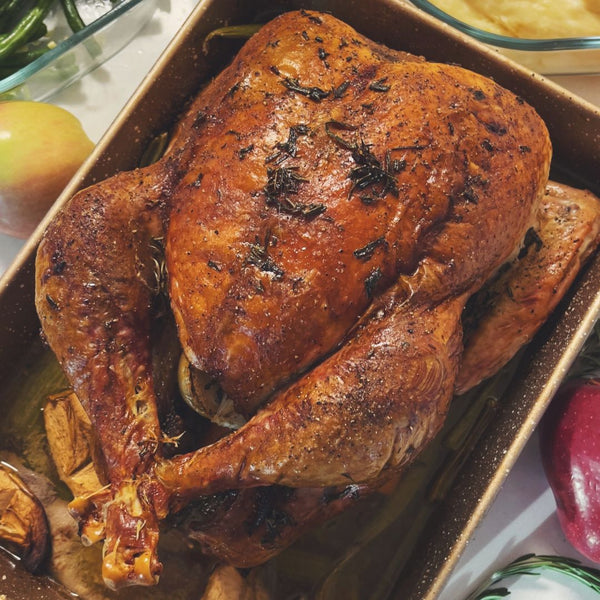 Golden roasted turkey in a pan