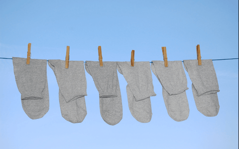 Socks drying under sun on a clothesline