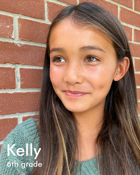 young tan woman with long brown hair, smiling with dimples, named Kelly, 6th grade