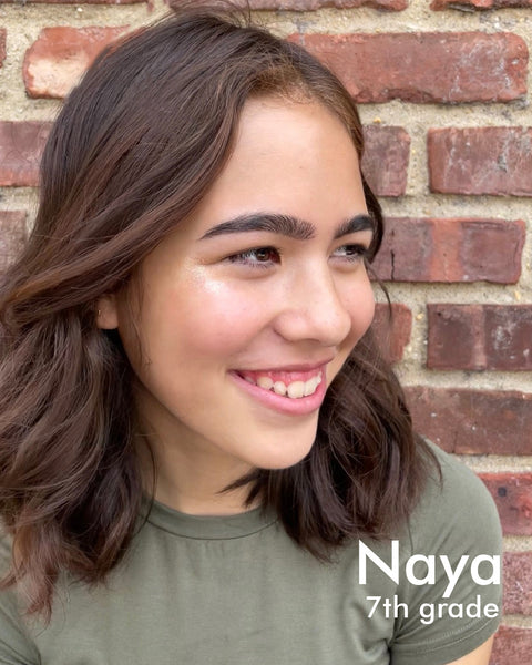 young woman with smile and highlighter, med length brown hair - named Naya, in 7th grade