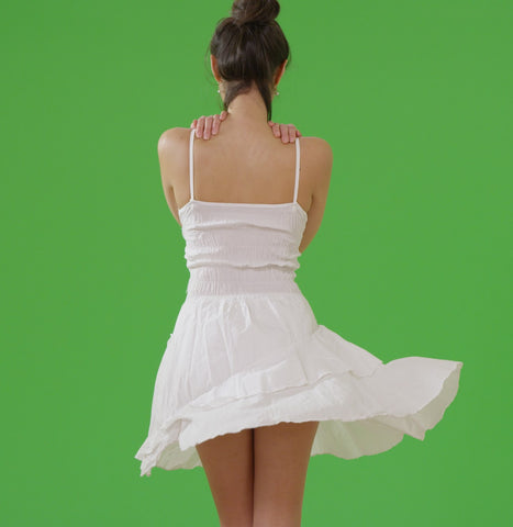 back of woman in white sundress 