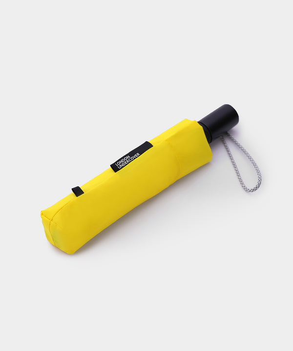 yellow compact umbrella