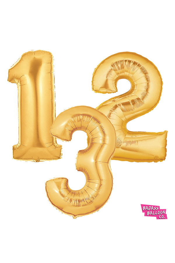 gold birthday number balloons