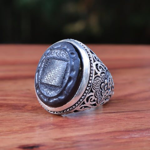 Black aqeeq stone ring in silver on Craiyon