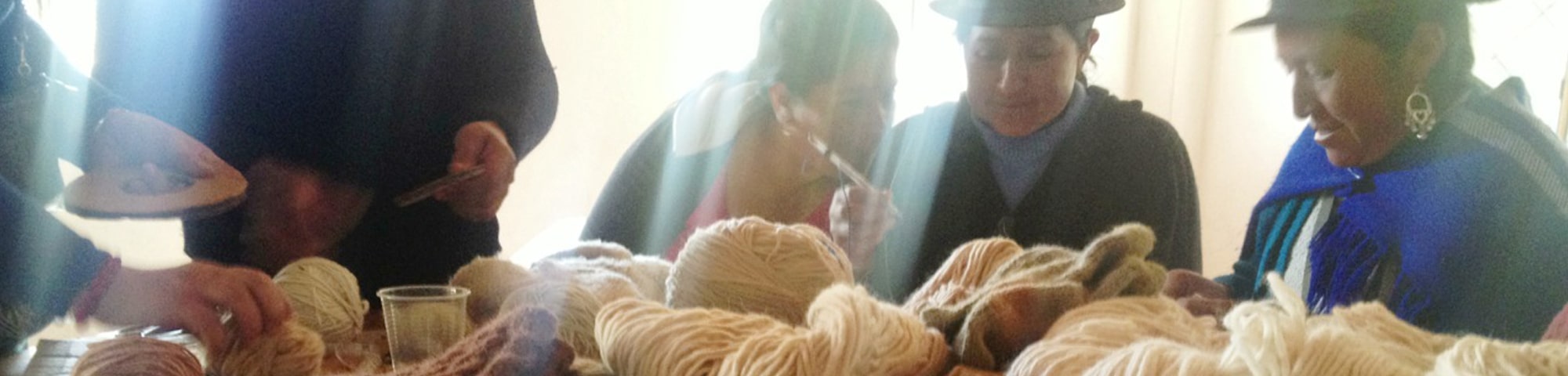 Female Artisans making wool accessories handmade in Ecuador