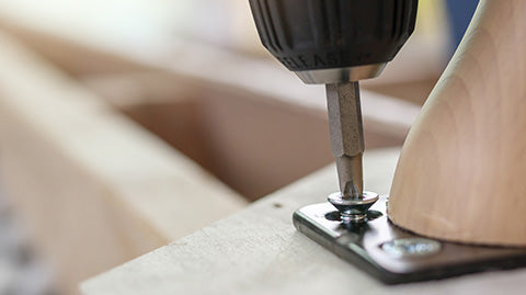 A close-up view of a screwdriver screwing