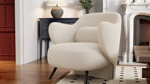 In a Living Room, There is Right-Side's Acute Angle Front View of A Luxurious, Cream, Hardwood Frame, Sleek Black Steel Legs, Erica Boucle Single Decorative Chair.