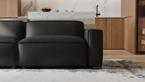 Right-Side, Armrest and Half Seat Close-Up View of Modern, Black, Loveseat, Full Aniline Top Grain Leather Modular Sofa in a room.