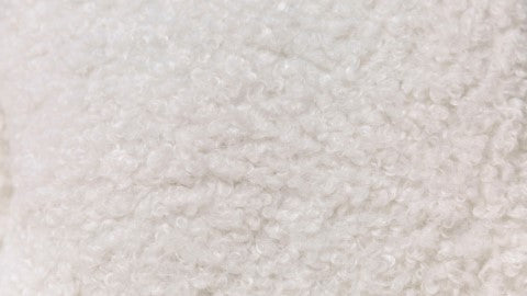 A Close-Up View of Cream Boucle Fabric.