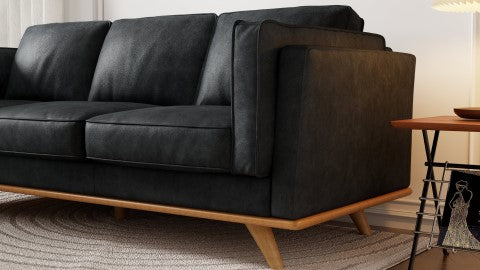 Wooden Leg Close-Up View of A Modern, Black, Single, Leather Artisan Sofa