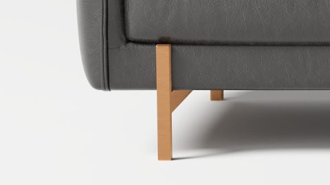 Steel Brass Finish Leg Close-Up View of A Modern, Midnight Black, Three Seats, Gabriele Aniline Top Grain Leather Sofa.