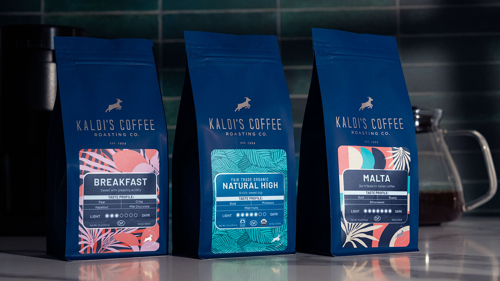 3 Kaldi's Coffee blends in navy bags with varying roast levels