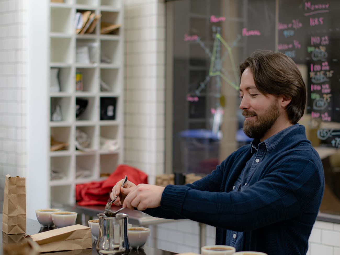 Andrew cupping coffee in the Cupping Room