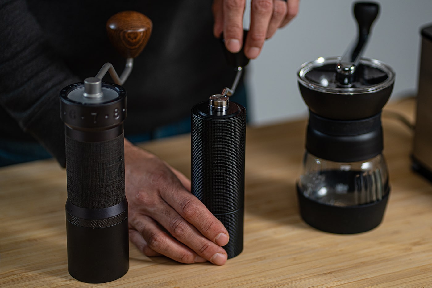 3 types of hand grinders - the 1ZPresso K-Max, the Timemore Chestnut C3, and the Hario Skerton