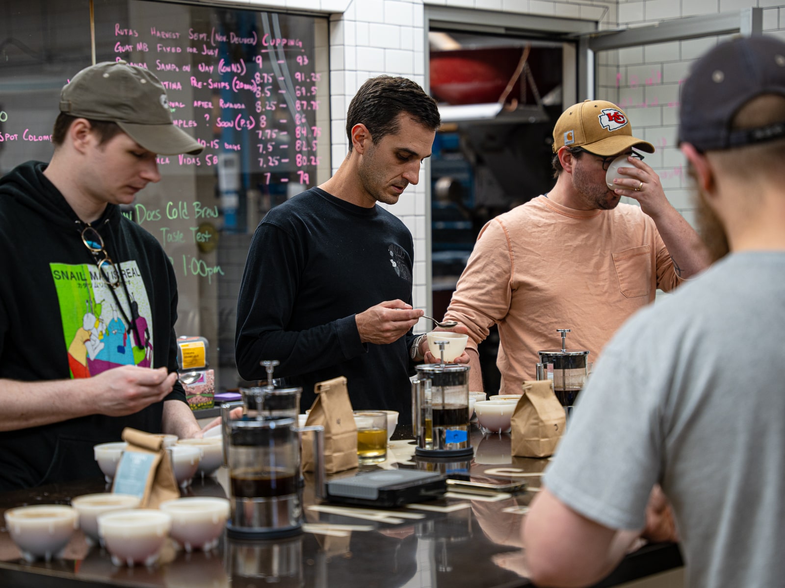 Team tasting cold brew coffee next to hot coffee