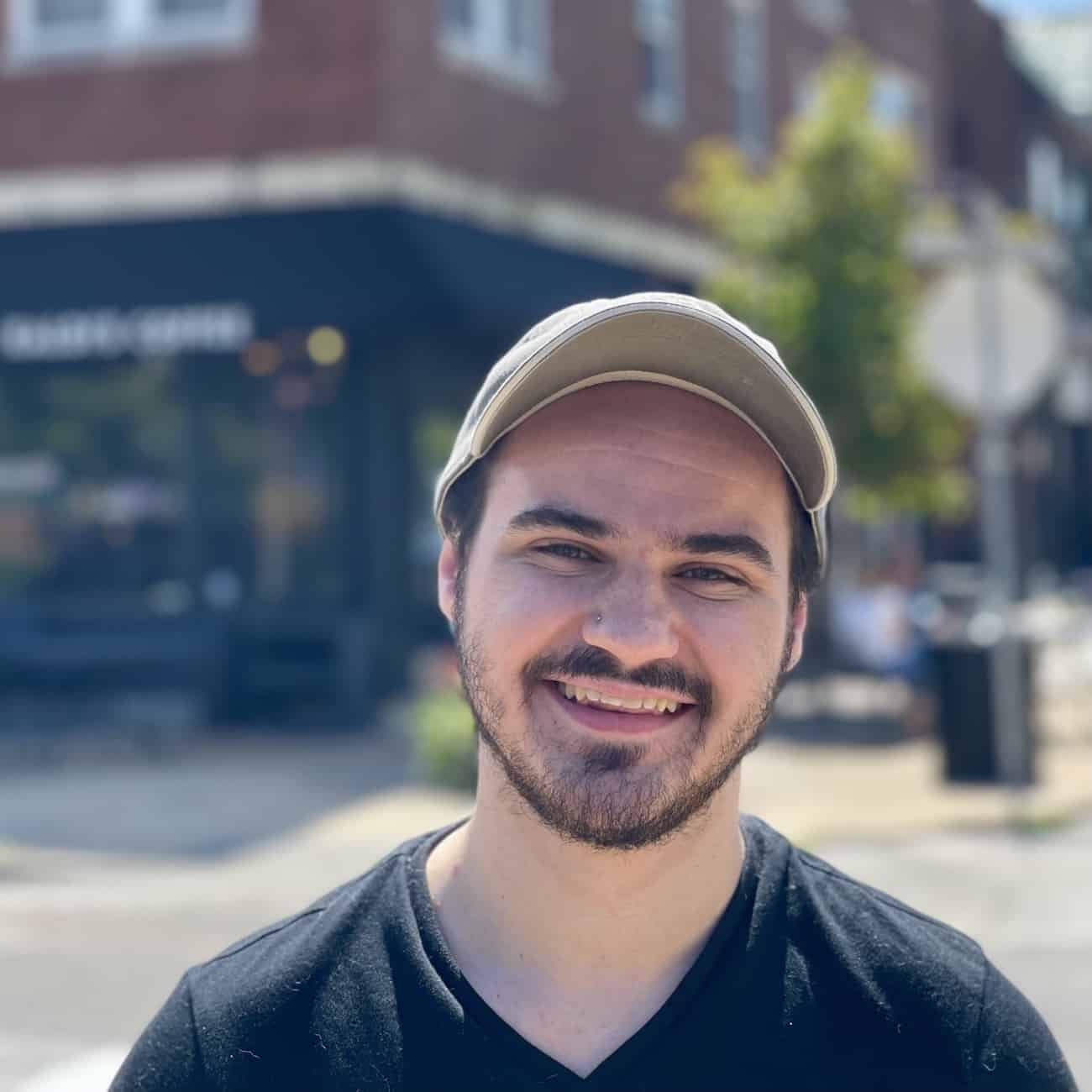 Theo standing outside of Kaldi's Coffee on Demun in Clayton, MO