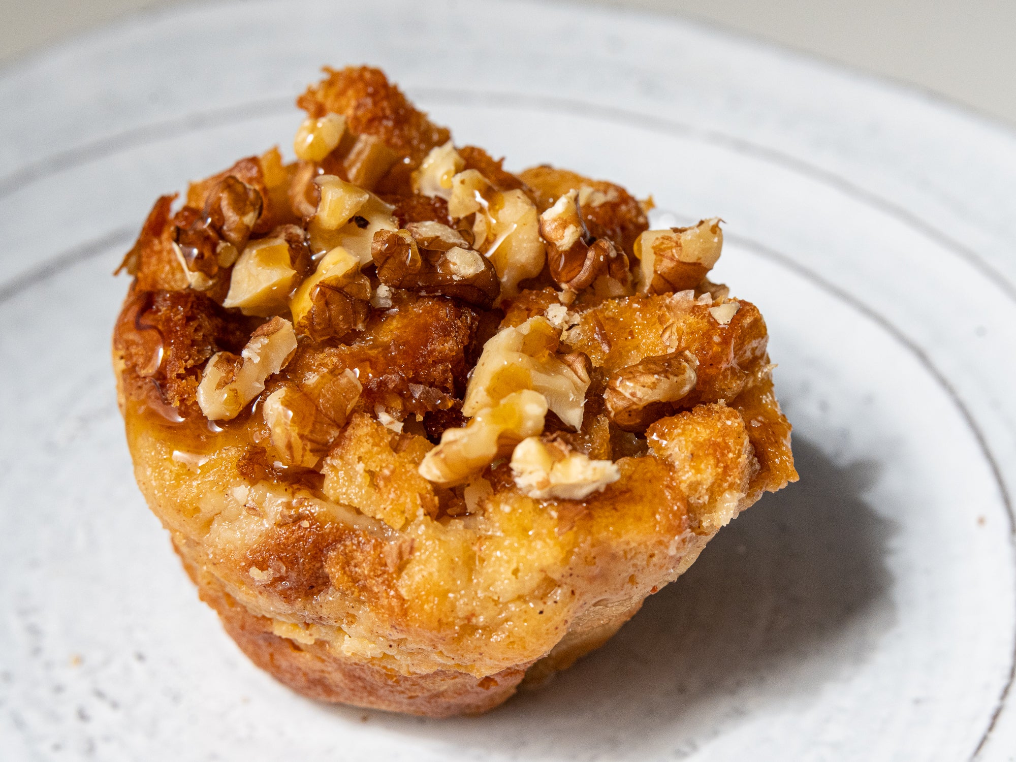 Bread pudding topped with walnuts and caramel
