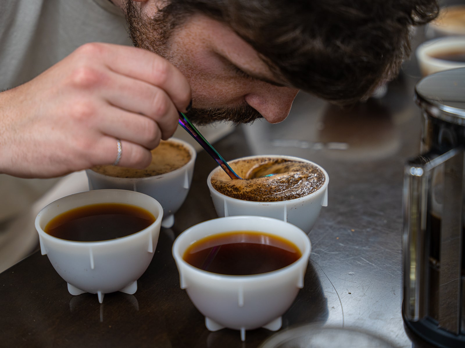 Breaking the crust in a cupping bowl