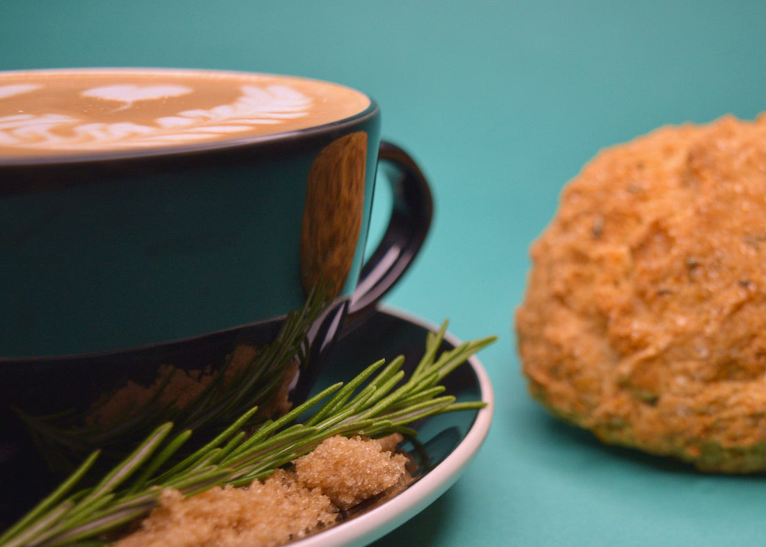 Brown Sugar Rosemary Latte next to scone