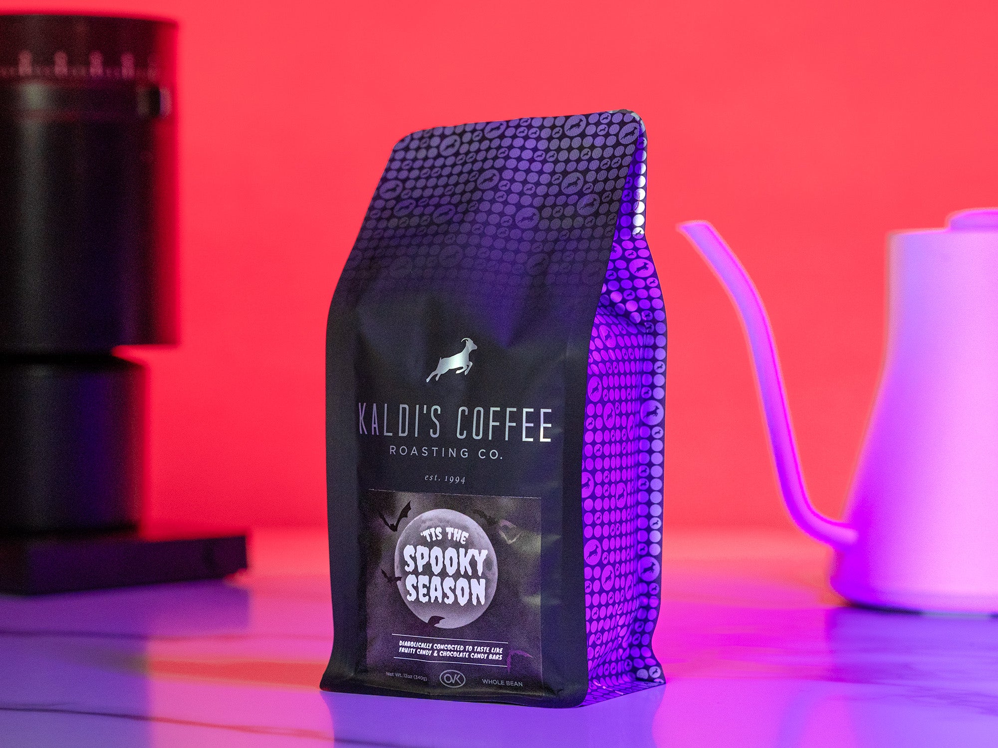 A bag of Spooky Season sits on a counter with brewing equipment