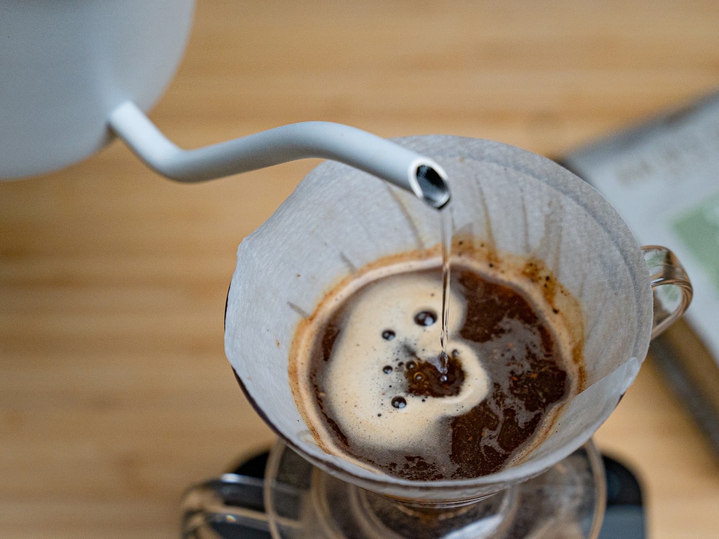 Pouring from a gooseneck kettle into the V60