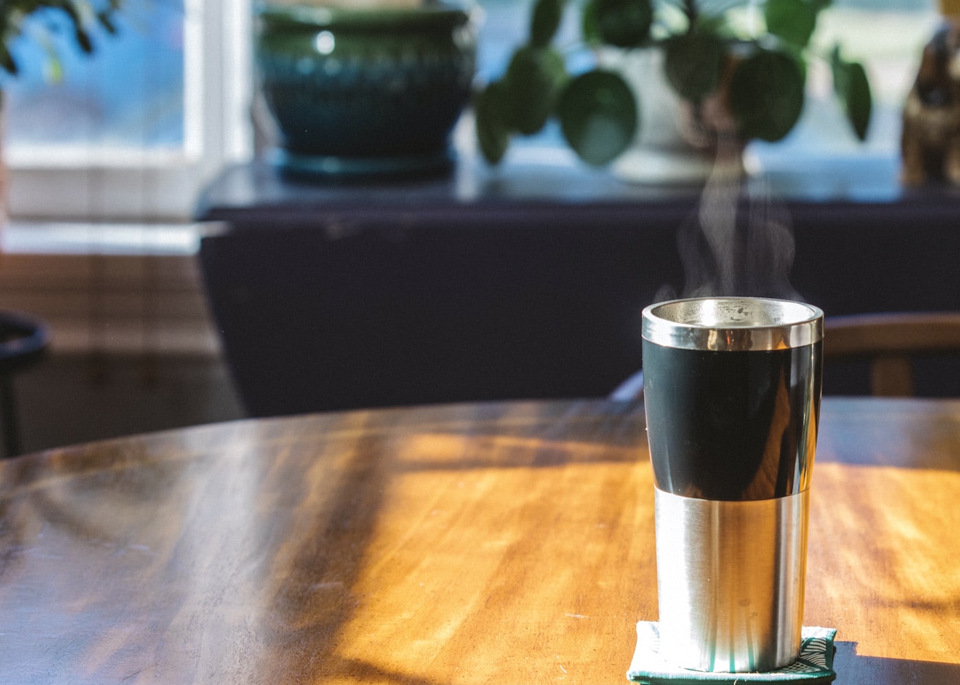 Hot coffee in a stainless steel tumbler