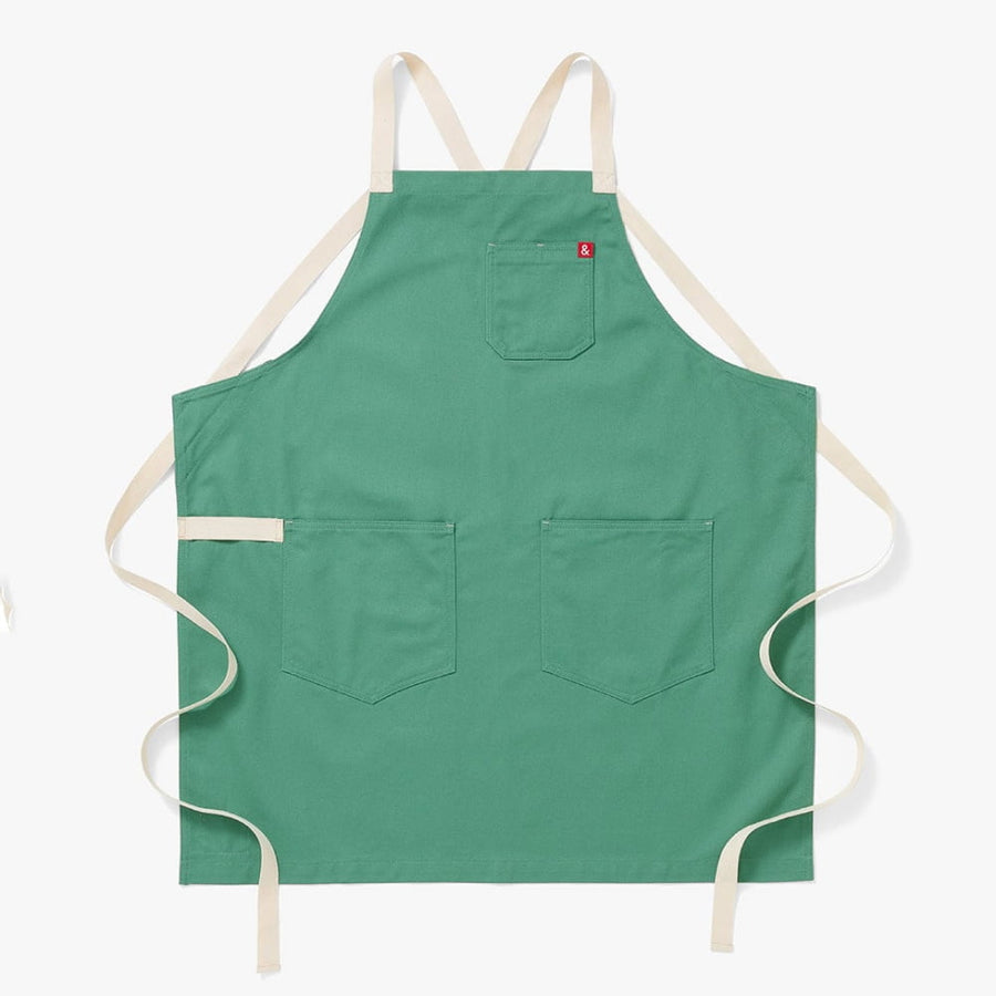 https://cdn.shopify.com/s/files/1/0187/0608/files/Julep-Green-Crossback-Apron-1_4aa785a5-0589-486d-962d-a0ab426dd362_900x900.progressive.jpg?v=1690563216