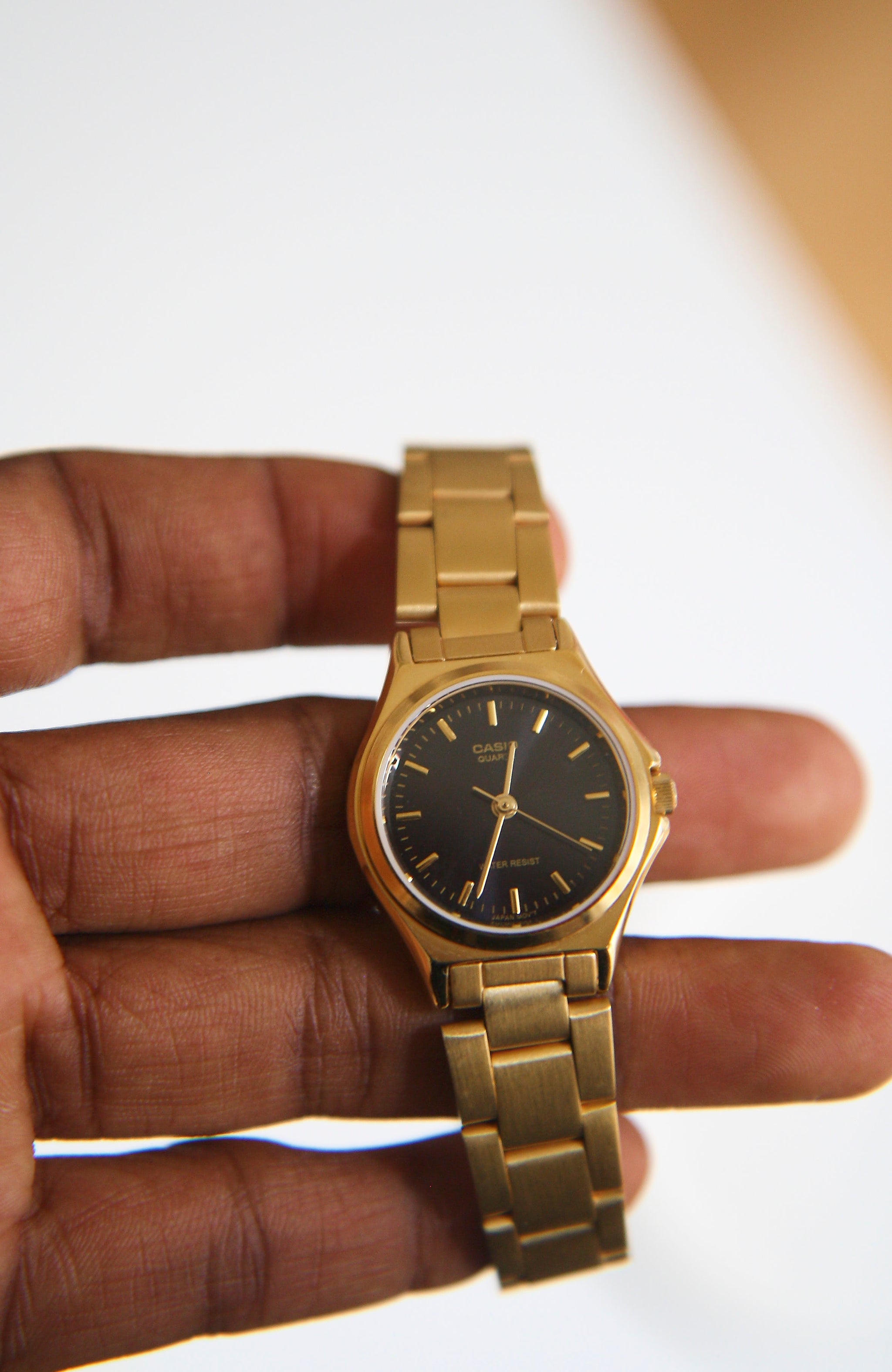 casio gold watch black face