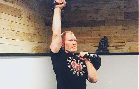 Todd working out with Kettlebells