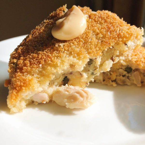 Crispy sardine cake with a dab of escabeche aioli atop - Donostia Foods