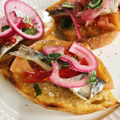 Sardinillas with Piquillo Pepper & Pickled Onions on Garlic Toast