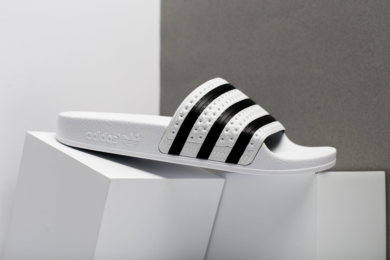 black and white adilette slides