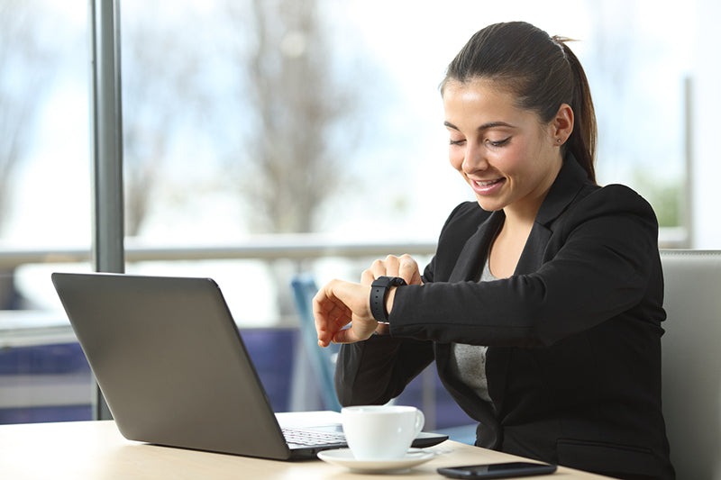 woman checking her smart watch