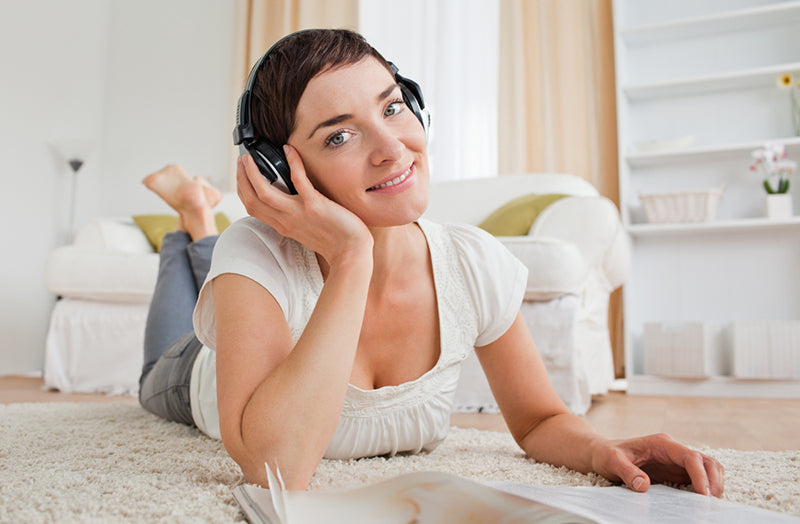 woman listening to music using bluetooth headphones