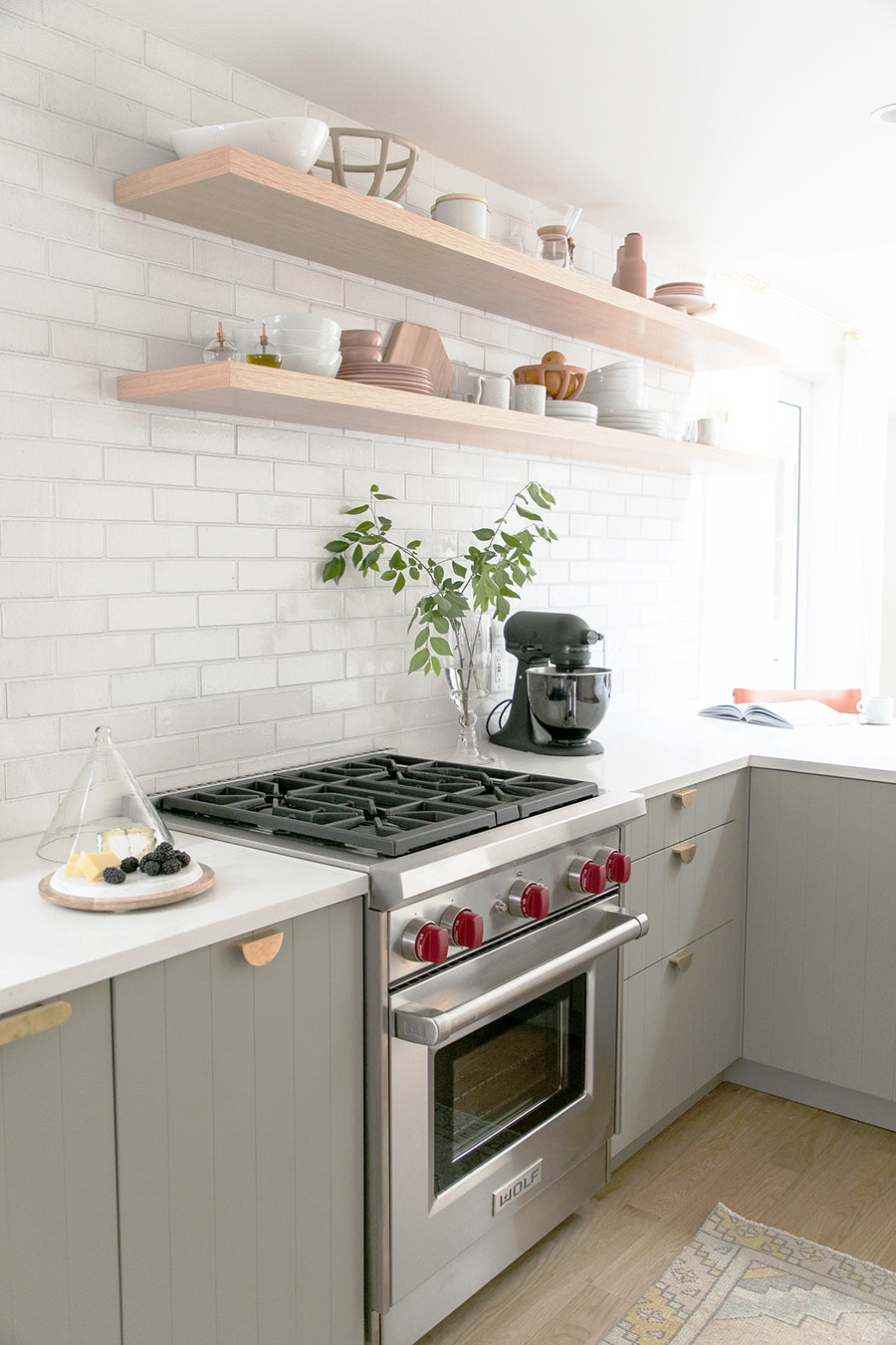 kitchen floating shelves and beaded cabinets