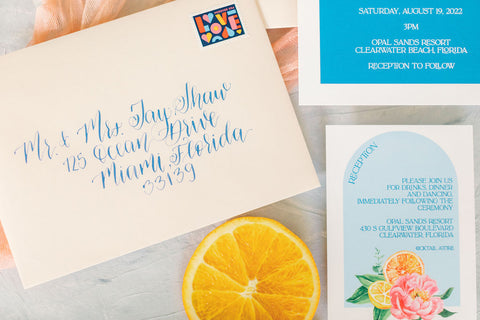 blue modern calligraphy for citrus wedding invitations by orlando invitation designer fioribelle