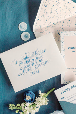 white wedding envelope with modern calligraphy in blue ink - how to address your wedding invitations