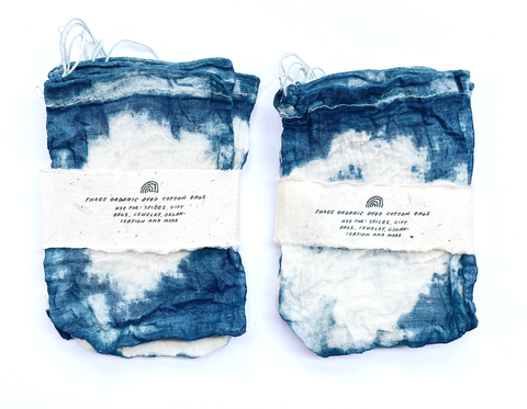 two indigo dyed cotton drawstring bags