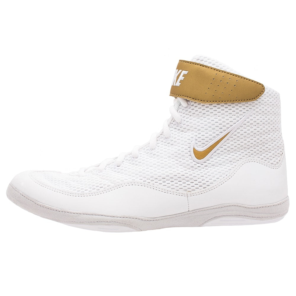 gold and white nike freeks