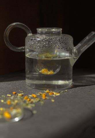 A glass pot of tea