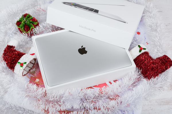 New-MacBook-Pro-in-a-box-surrounded-by-Christmas-decorations