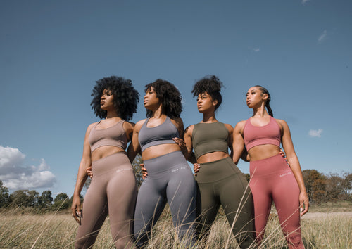 4 Black Women wearing Roam Loud activewear