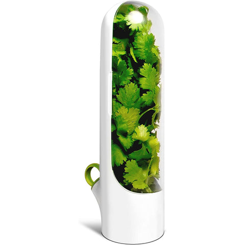 A white herb saver and keeper gadget with fresh herbs inside designed to keep herbs fresher for longer.