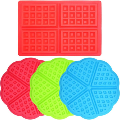 Red, blue and green heart shaped silicone waffle molds along with a red rectangular waffle mold used for making waffles.