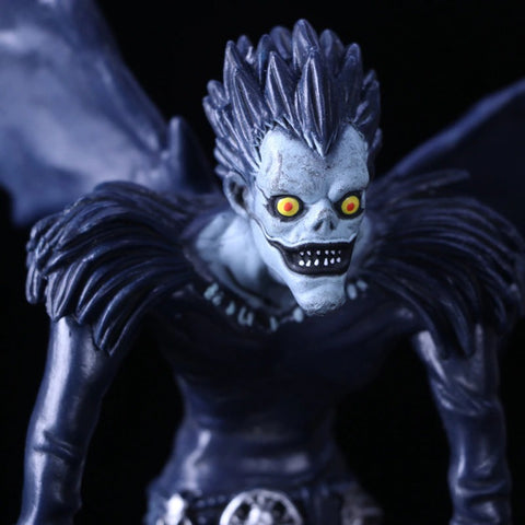 A close up view of a figurine of Ryuk from Death Note