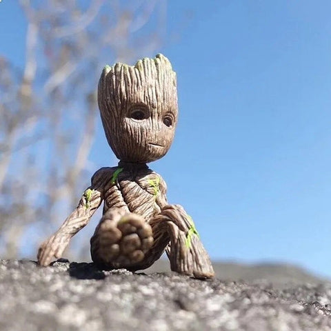 A Guardians of the Galaxy Groot Figurine sitting on a rock