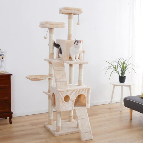 A beige colored multi level cat tower with a white cat sitting on one of the many levels